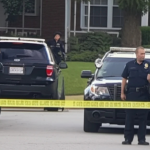Houston community residents gathered in mourning after fatal shooting of 11-year-old boy